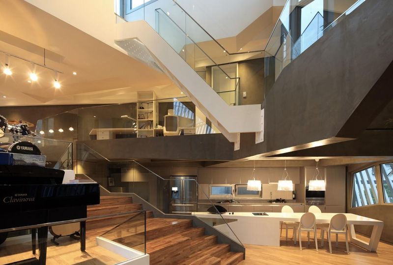 îlot de cuisine & escalier accès étage - Kyeong Dok Jai par Uroje Khm Architects - Corée du Sud