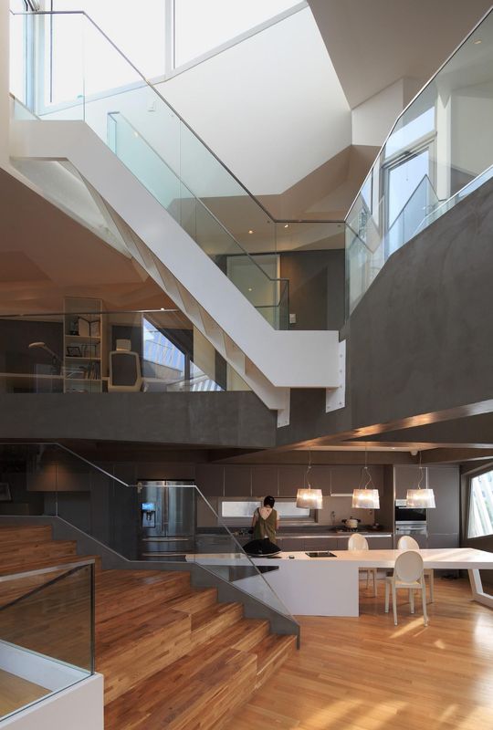 îlot de cuisine & escaliers étage - Kyeong Dok Jai par Uroje Khm Architects - Corée du Sud